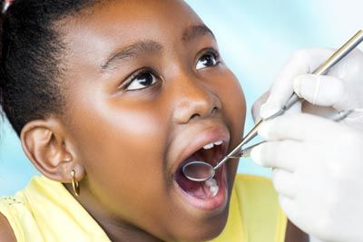 young girl getting a dental checkup at Broadway Heights Dental