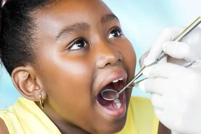 young girl getting a dental checkup at Broadway Heights Dental