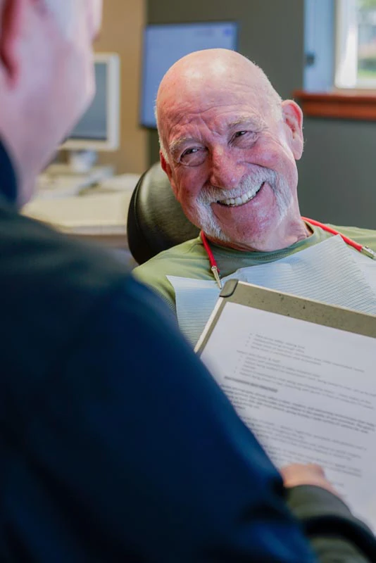 patient smiling during his visit to Broadway Heights Dental